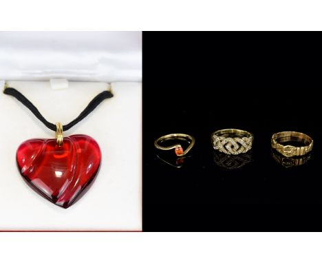 A Baccarat Crystal Pendant Boxed Ruby glass heart shaped textured pendant on leather cord, etched to underside 'Baccarat' Ver