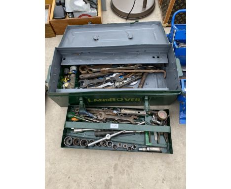 A GREEN METAL TOOL BOX WITH AN ASSORTMENT OF TOOLS TO INCLUDE SOCKETS AND SPANNERS ETC 