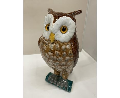 A LARGE CERAMIC MODEL OF AN OWL 