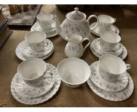 A QUANTITY OF WEDGWOOD 'APRIL FLOWERS' CHINA TO INCLUDE CUPS, SAUCERS,S PLATES, TEAPOT, CREAM JUG, SUGAR BOWL - 1 CUP A/F 