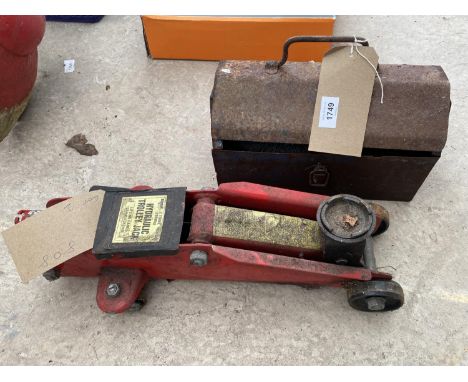A TWO TONNE TROLLEY JACK AND A TOOL BOX WITH AN ASSORTMENT OF TOOLS 