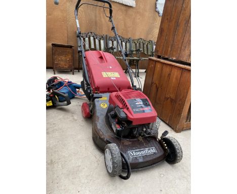 A MOUNTFIELD PETROL LAWN MOWER WITH BRIGGS AND STRATTON ENGINE AND GRASS BOX 