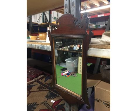 A VINTAGE MAHOGANY FRAMED MIRROR 32.5CM X 64CM 