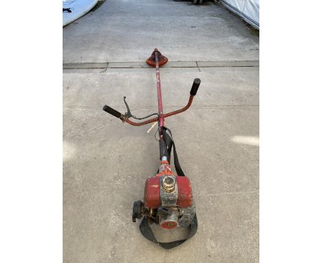 A PETROL GRASS STRIMMER WITH A STHIL ENGINE 