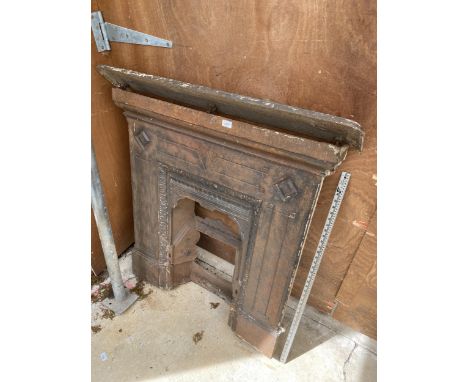 A LARGE DECORATIVE CAST IRON FIRE PLACE WITH MANTLE SHELF 