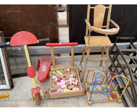 AN ASSORTMENT OF CHILDRENS ITEMS TO INCLUDE A HIGH CHAIR, A SCOOTER AND A WALKER ETC 