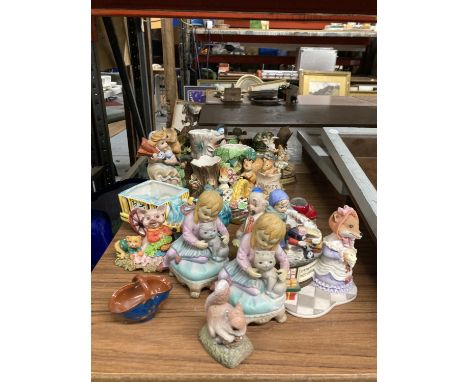 A LARGE COLLECTION OF CERAMIC AND RESIN FIGURINES TO INCLUDE THE LEONARDO COLLECTION, HORNSEA ANIMAL THEMED PLANTERS, ETC 
