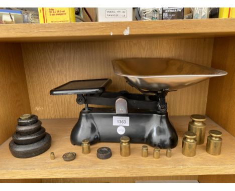 A SET OF KITCHEN BALANCE SCALES WITH VARIOUS CAST AND BRASS WEIGHTS 