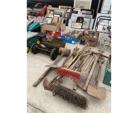 AN ASSORTMENT OF GARDEN TOOLS TO INCLUDE A RANSOMES VINTAGE PUSH MOWER, SPADES AND FORKS ETC 