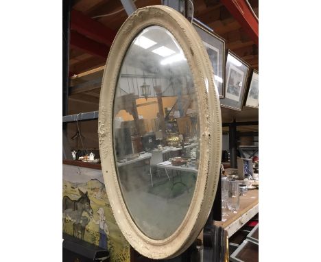 A CREAM FRAMED VINTAGE OVAL MIRROR WITH BEVELLED GLASS 75CM X 48CM 