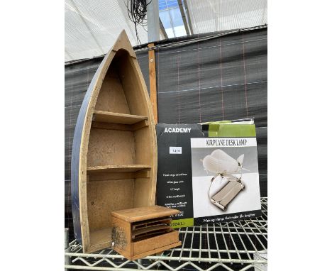 AN AIRPLANE DESK LAMP, A FOLDING CARD BOX AND A WOODEN BOAT 