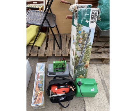 AN ASSORTMENT OF TOOLS TO INCLUDE A BLACK AND DECKER JIGSAW, A BATTERY CHARGER AND A HEDGE TRIMMER ETC 