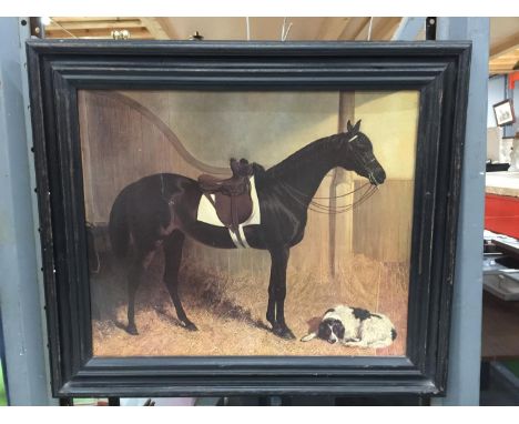 A DARK FRAMED PRINT OF A HORSE AND A DOG IN A STABLE 