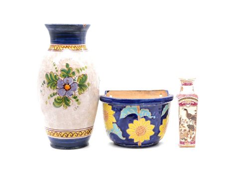 Collection of ceramic planters and vases, including a pottery swan planter, wall pockets, modern Chinese blue and white vase,