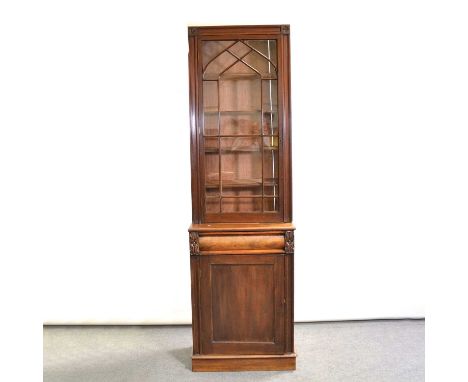 William IV mahogany narrow bookcase, glazed door enclosing fixed shelves, frieze drawer above a cupboard, plinth base, width 