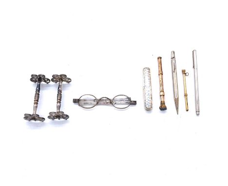 Pair of George V silver spectacles, London 1825, folding arms, three propelling pencils, white metal knife rests and a corksc