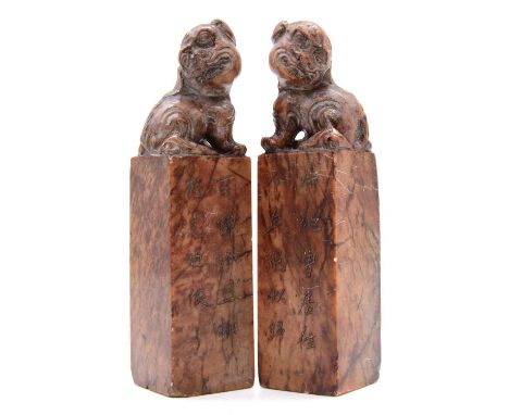 Pair of Chinese carved soapstone scroll seals, kylin tops, each with ten characted inscription, 15cm.Qty: 2