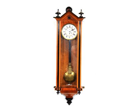 Vienna wall clock, walnut and ebonised case, architectural pediment, turned finials, circular enamelled dial with Roman numer