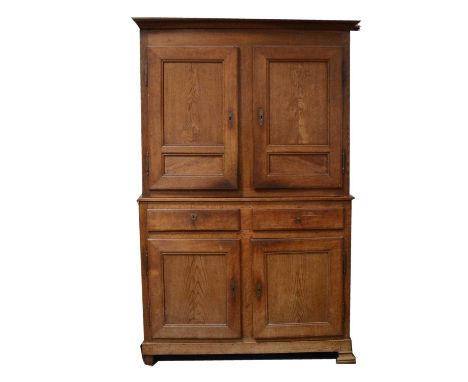 Joined oak pantry cupboard, 19th Century, cavetto cornice, the upper section with two panelled doors, the base with two drawe