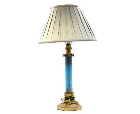 Edwardian table lamp, adapted for electricity, the column with turquoise and gilt enamelled glass on an octagonal gilt metal 