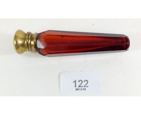 A Victorian ruby glass tapered scent bottle with gilt metal lid and inner stopper