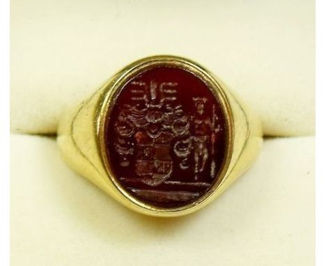 An 18 carat gold signet ring set carved cornelian, 10.5g - size K
