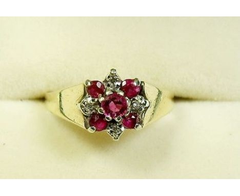 A 9 carat ruby and diamond ring - size L