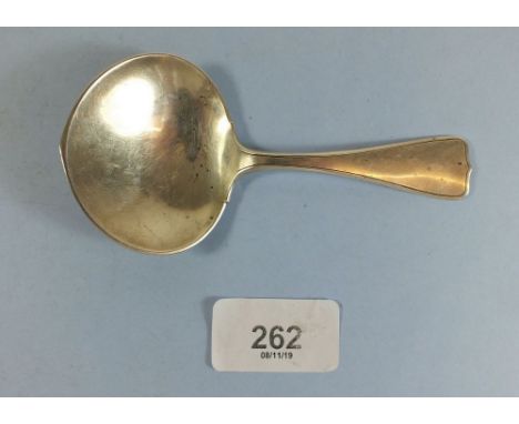 An Arts and Crafts sterling silver jam/caddy spoon by Arthur Stone