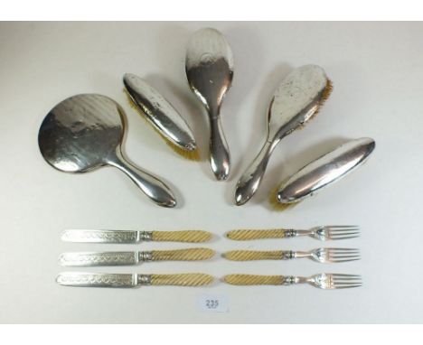 A silver five piece brush and mirror set a/f, and a part dessert cutlery set