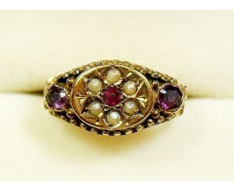 A Victorian 15 carat gold ruby and seed pearl ring - size H