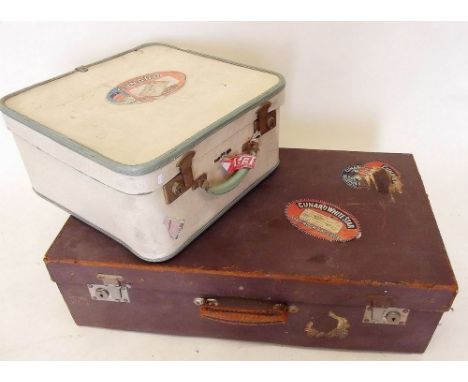 Two vintage suitcases with Cunard Line baggage labels