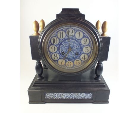 A Victorian mantel clock with blue and white porcelain dial