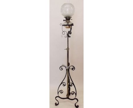 A Victorian standard oil lamp on brass and iron stand with etched glass shade