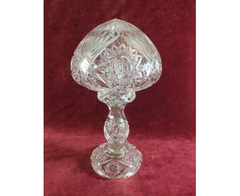 A cut glass table lamp and shade