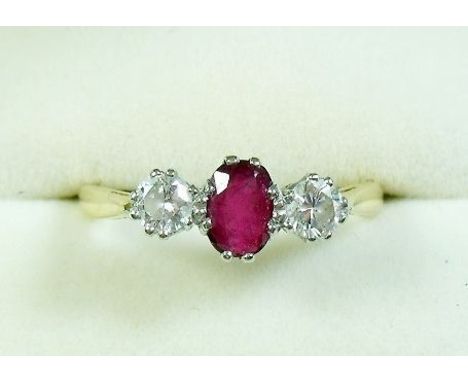 An 18 carat gold ruby and diamond ring size Q 1/2