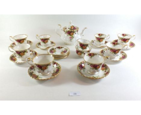 A Royal Albert Country Roses tea service comprising teapot, six cups and saucers, milk and sugar