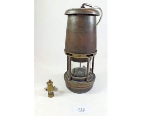 A miners lamp marked 'The Wolf Safety Lamp Co (Wm Maurice) Ltd' 'Sheffield - Wolf Type FG - M of P Safety Lamps ARP No B2/222