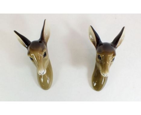 A pair of Midwinter faun head wall plaques