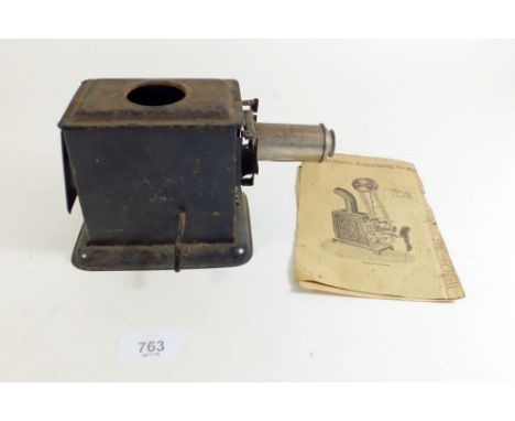 A German tinplate toy magic lantern ' Gebrauchs Auweisung, with original box  (poor) and instructions