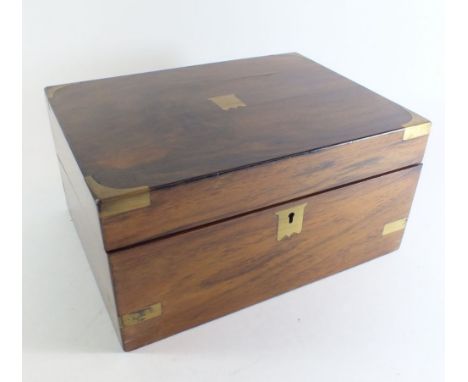 A Victorian walnut writing slope with brass mounts, fitted interior and original inkwell