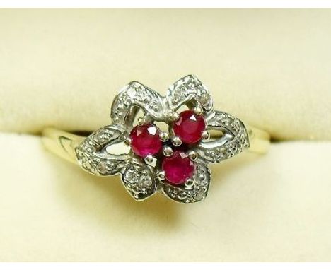 A 9 carat gold ruby and diamond ring - size R/S