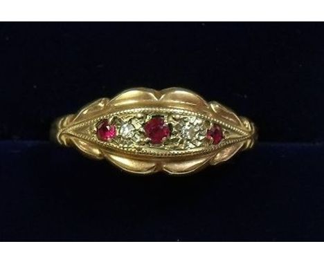 A Victorian 9 carat gold ruby and diamond ring - size N