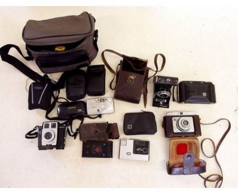 A box of assorted vintage Kodak Brownie and other cameras