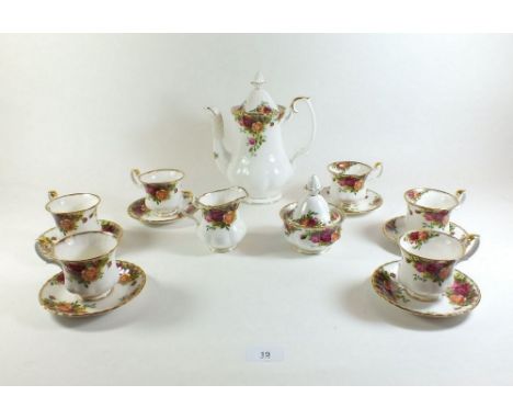 A Royal County Roses coffee set comprising: coffee pot, six cups and saucers, cream and sugar