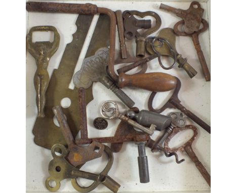 A collection of various clock keys, winders, corkscrews, whistle etc