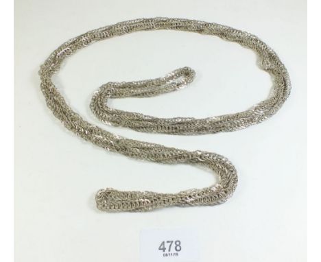 A vintage white metal long knitted chain necklace