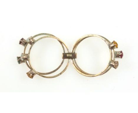 Yellow metal quadruple folding ring set coloured stones, gross 4.3grs 