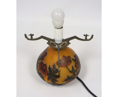 Gallé style table lamp with red floral overlay on an orange ground, with shade, H 27cm overall