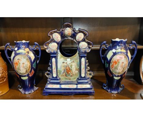 A pair of Vienna style baluster two handled vases, with classical scenes in polychrome to the reserve panels against a blue g
