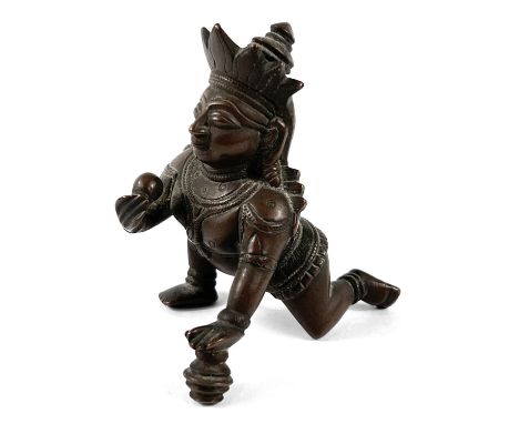 A 19th century Indian bronze weight depicting Chrishna kneeling, height 9cm.&nbsp;&nbsp;Appears in good condition.